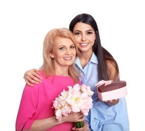 Young woman congratulating her mature mom on white background. Happy Mother's Day