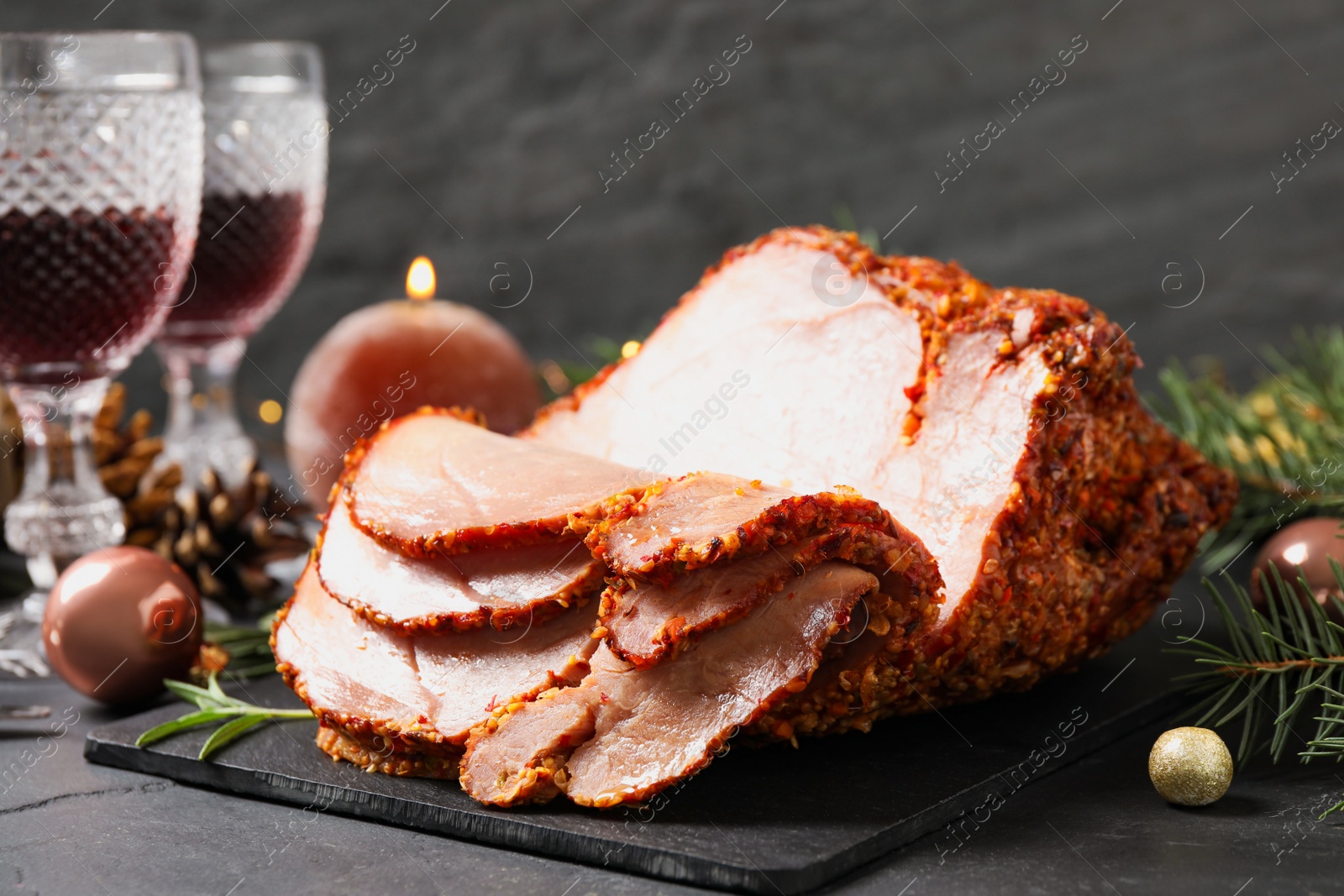 Photo of Delicious Christmas ham served on dark table