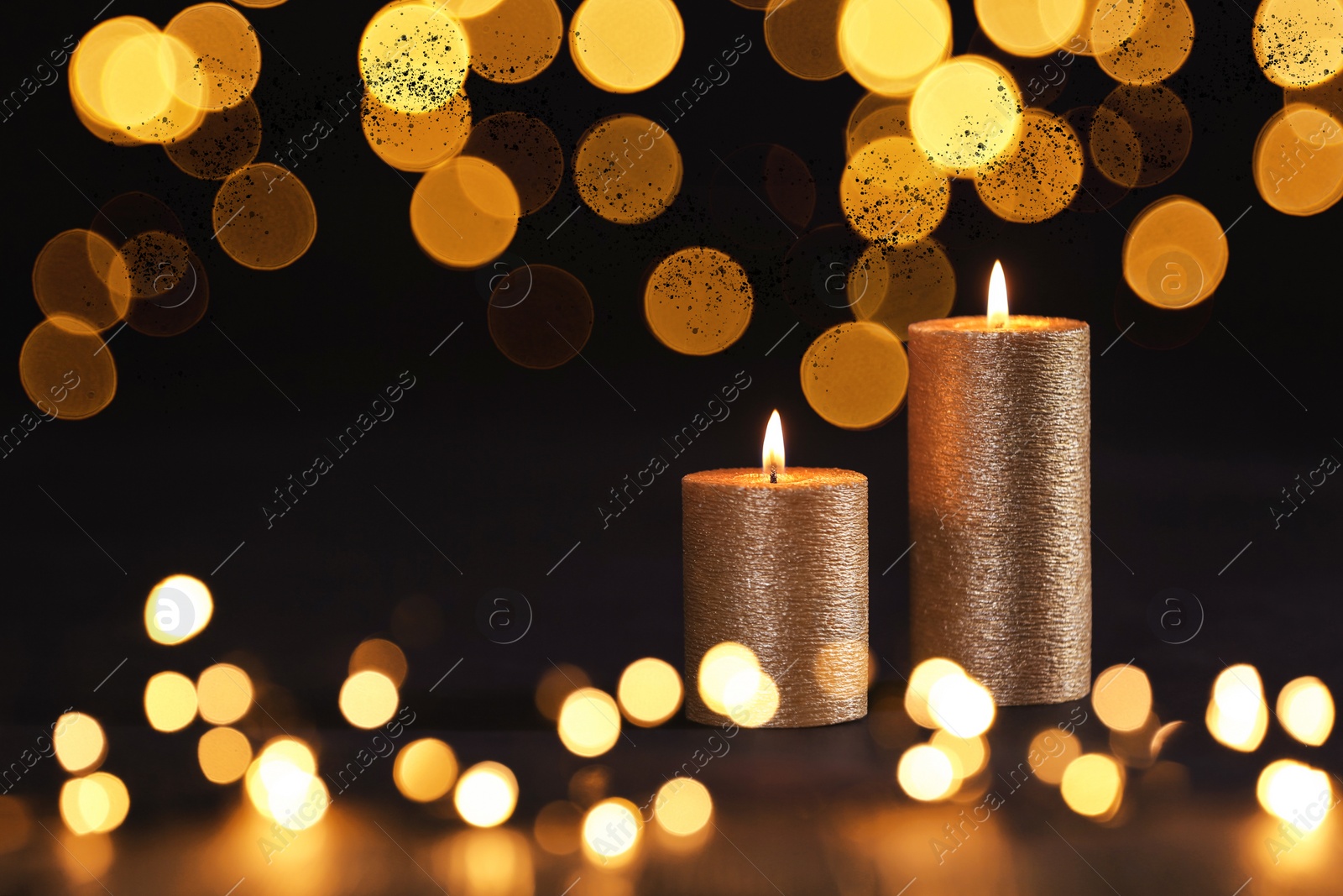 Image of Burning candles on dark background, bokeh effect