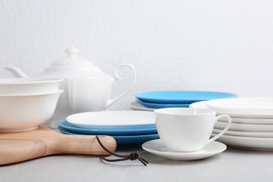 Photo of Set of dishware on table against white background