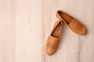 Pair of female shoes on floor