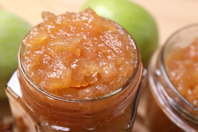 Delicious apple jam in jars, closeup view