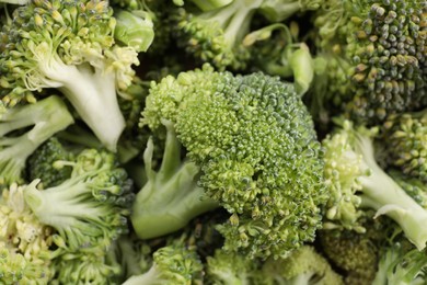 Photo of Fresh raw broccoli as background, closeup view