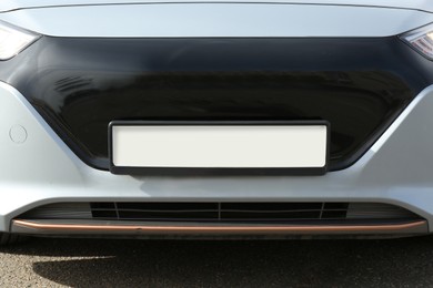 Photo of Car with vehicle registration plate outdoors, closeup