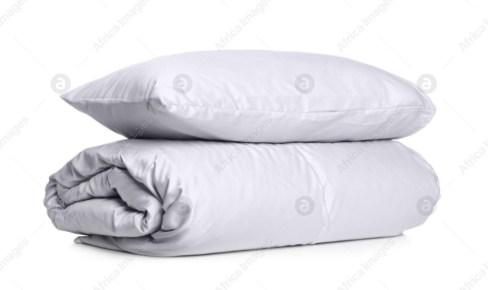 Photo of Stylish silky bed linens and pillow on white background