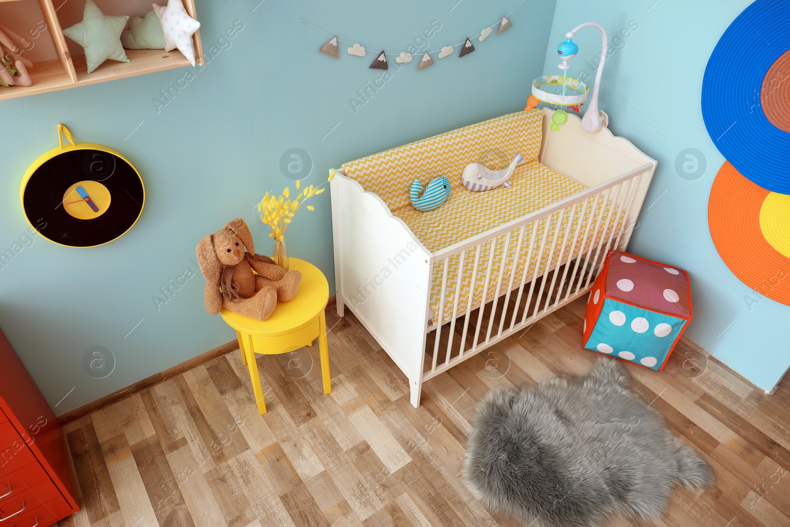 Photo of Interior of baby room with comfortable crib