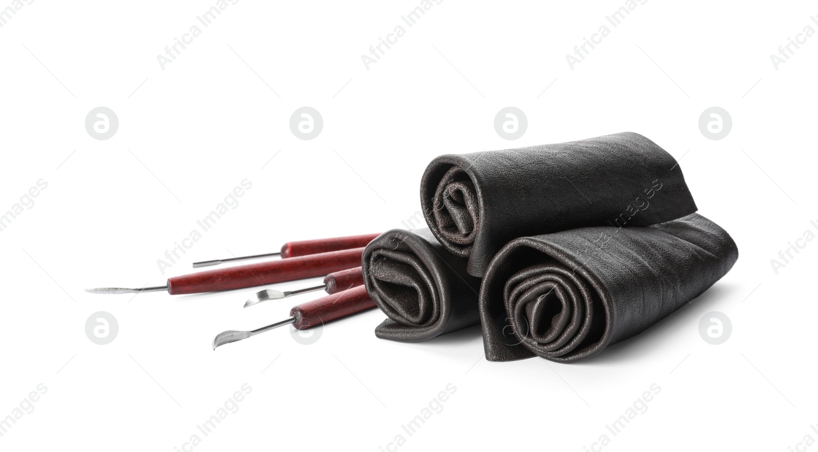 Photo of Leather samples and craftsman tools isolated on white