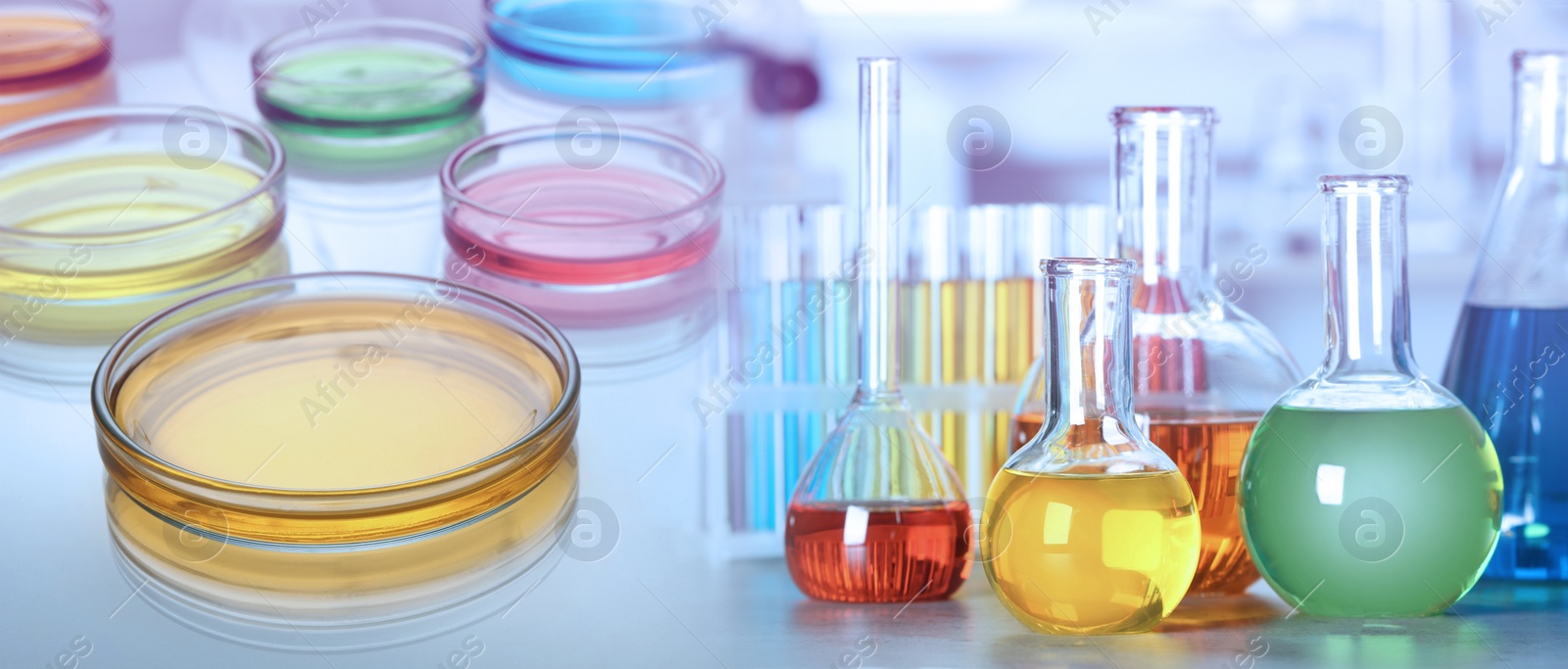 Image of Chemistry and chemical research. Collage of different laboratory glassware with colorful liquids . Banner design