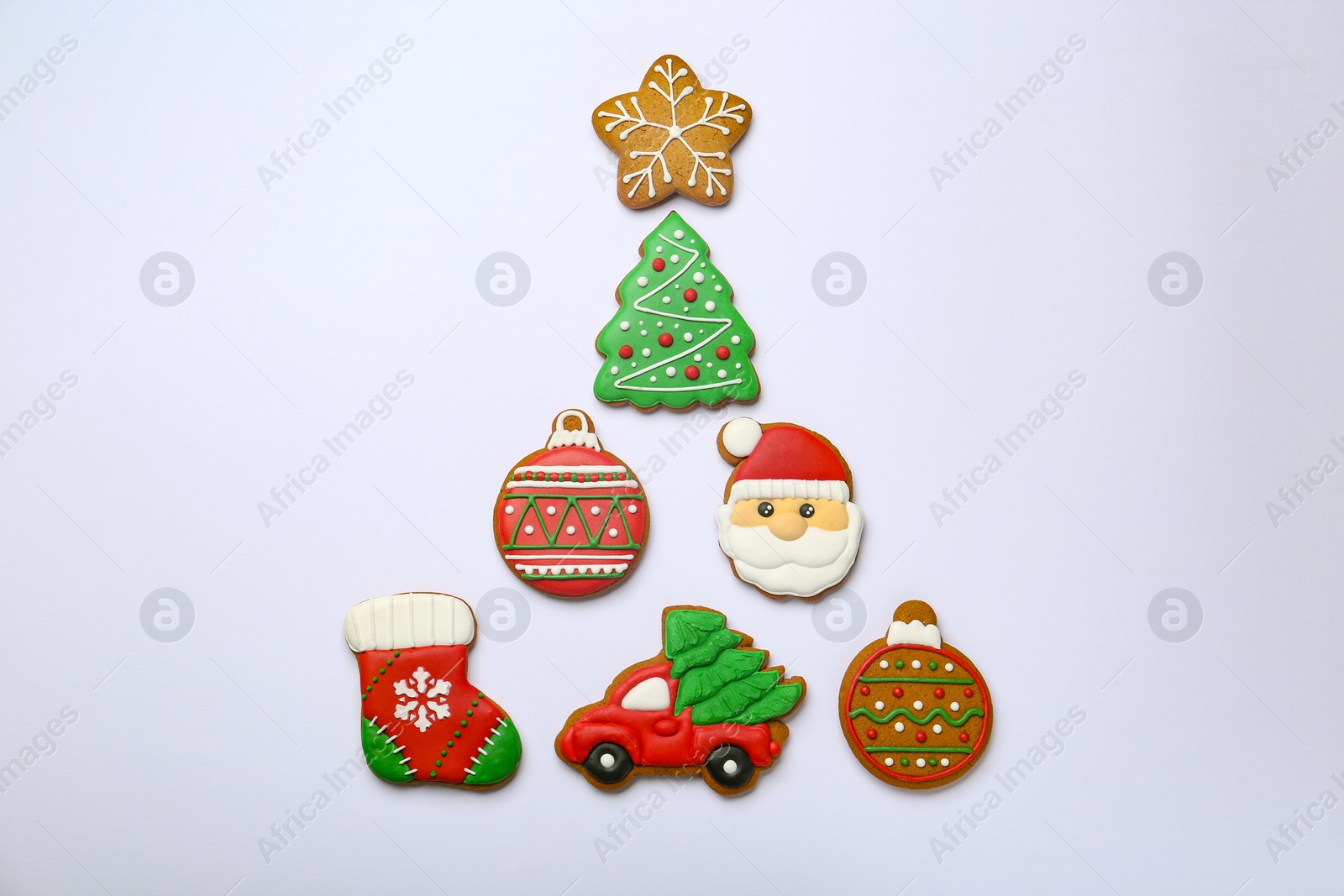 Photo of Different tasty Christmas cookies on white background, flat lay