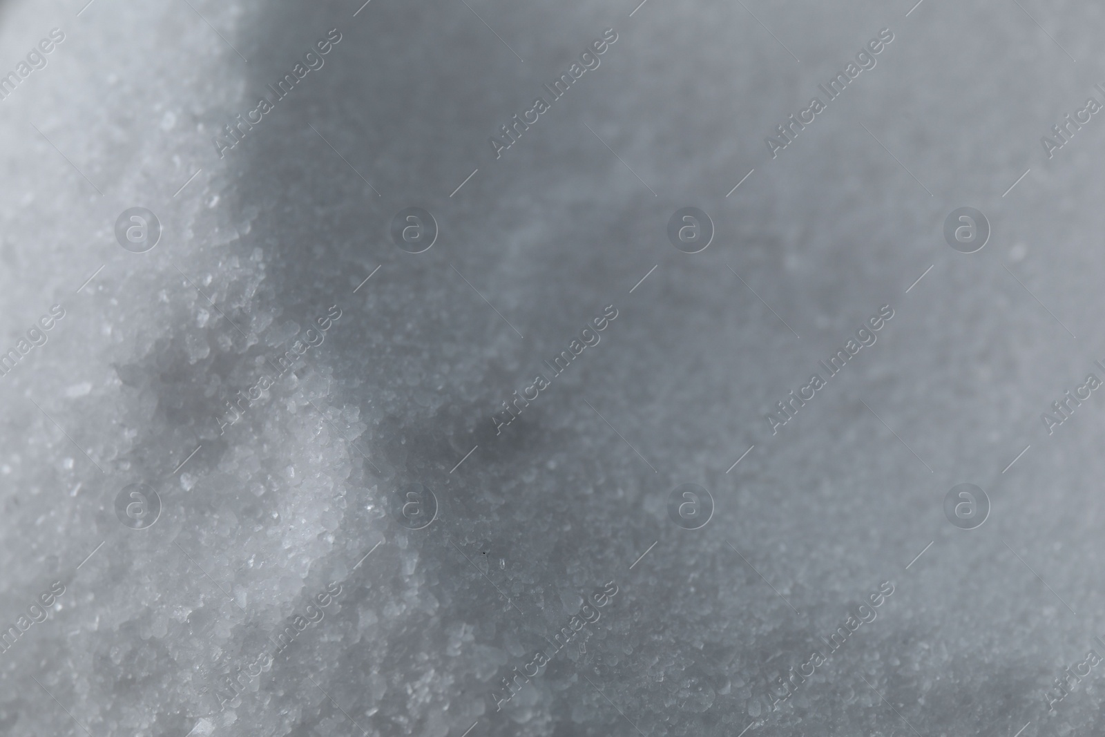 Photo of Organic white sea salt as background, closeup