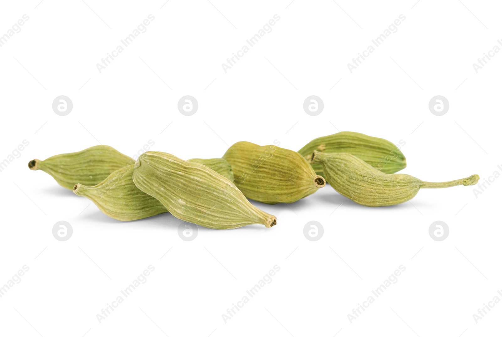 Photo of Pile of dry green cardamom pods isolated on white