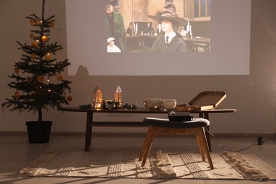 Lviv, Ukraine – January 24, 2023: Video projector screen displaying Harry Potter And The Philosopher’s Stone movie in cozy room