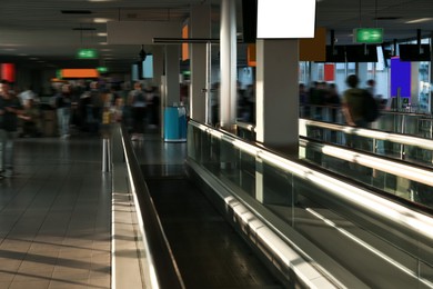 Photo of Interior of airport terminal with travelator. Air travel