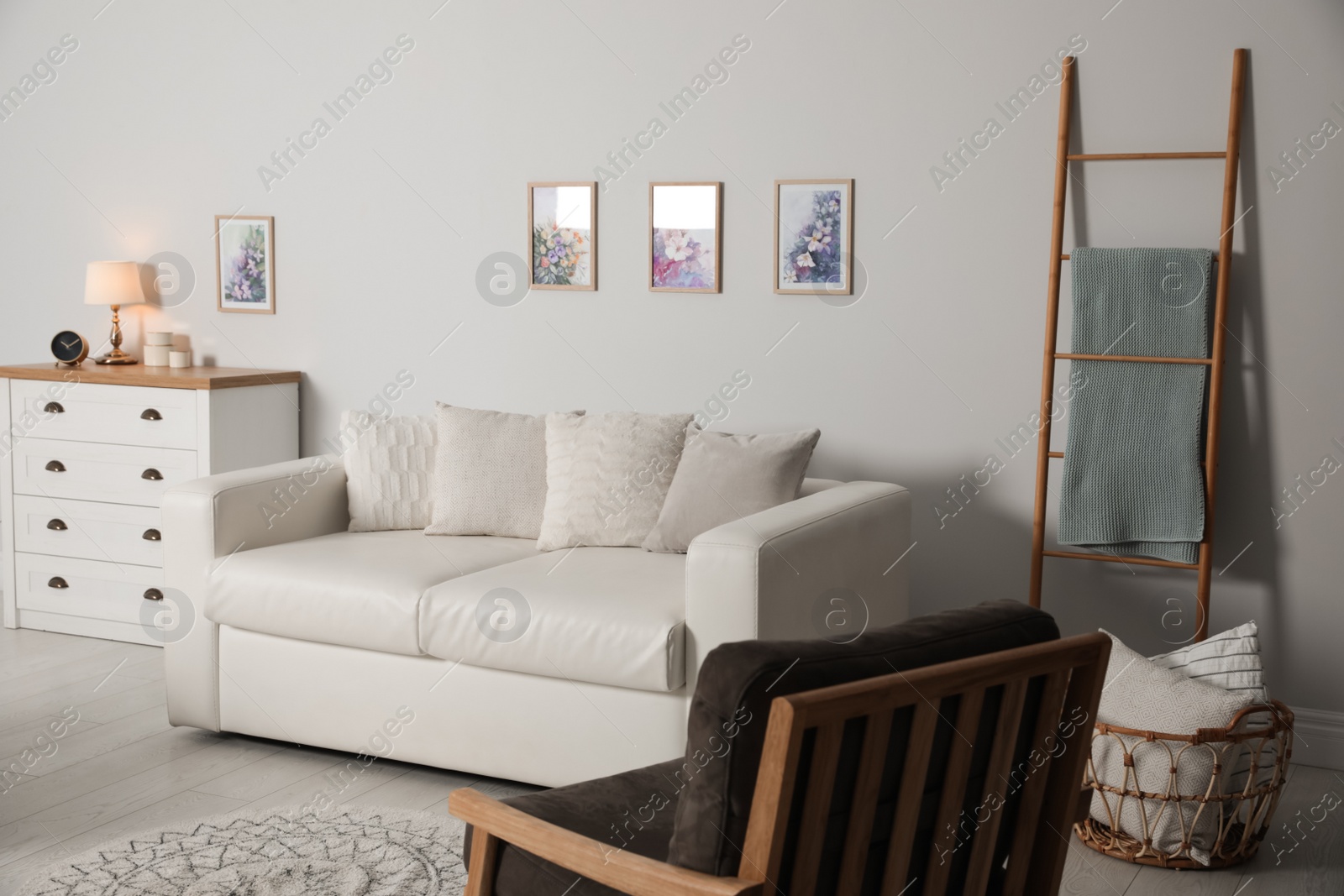 Photo of Modern living room interior with comfortable sofa and armchair