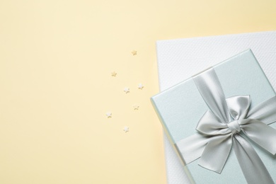 Photo of Beautiful gift boxes on beige background, top view. Space for text