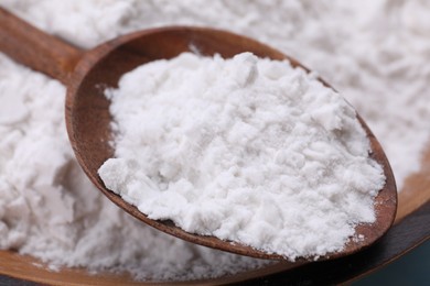 Wooden bowl and spoon of natural starch, closeup