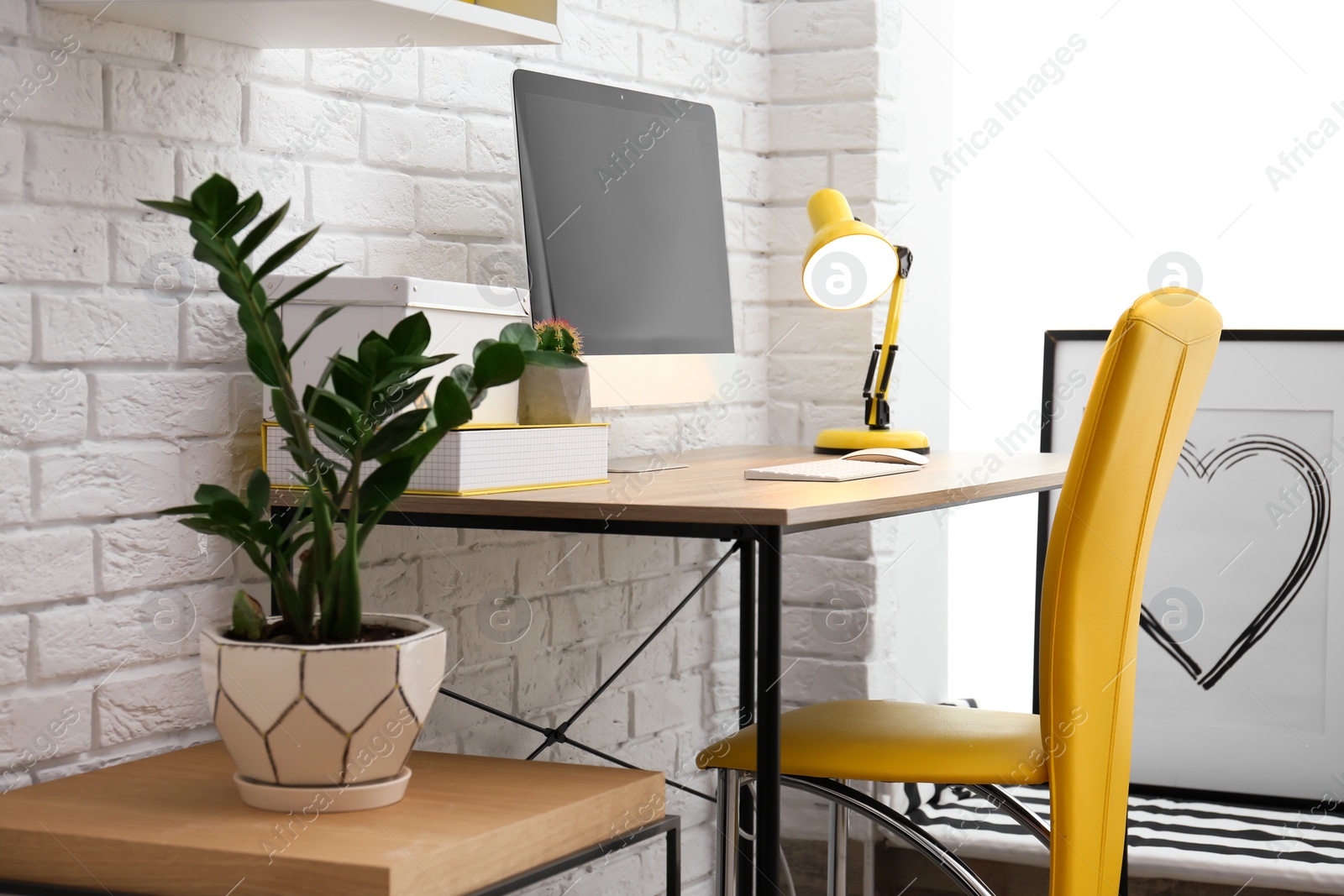 Photo of Comfortable workplace with computer on desk in home office