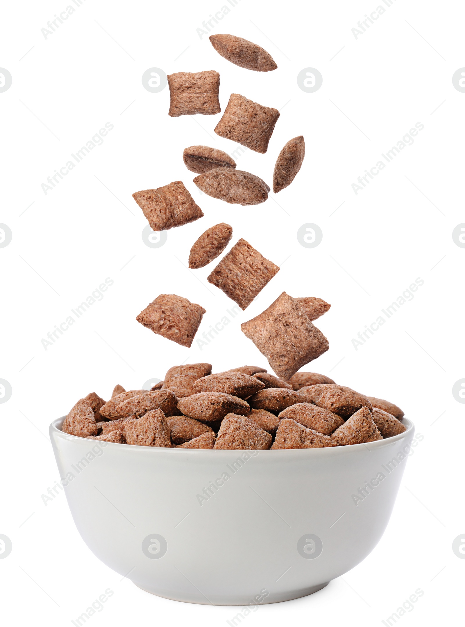 Image of Sweet crispy corn pads falling into bowl on white background 