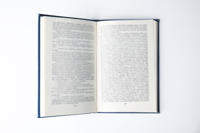 Photo of Open book on white background, top view