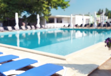 Blurred view of clean swimming pool on sunny day