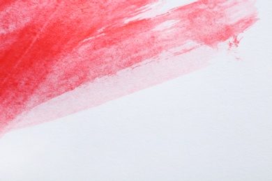 Abstract brushstroke of red paint isolated on white. Space for text