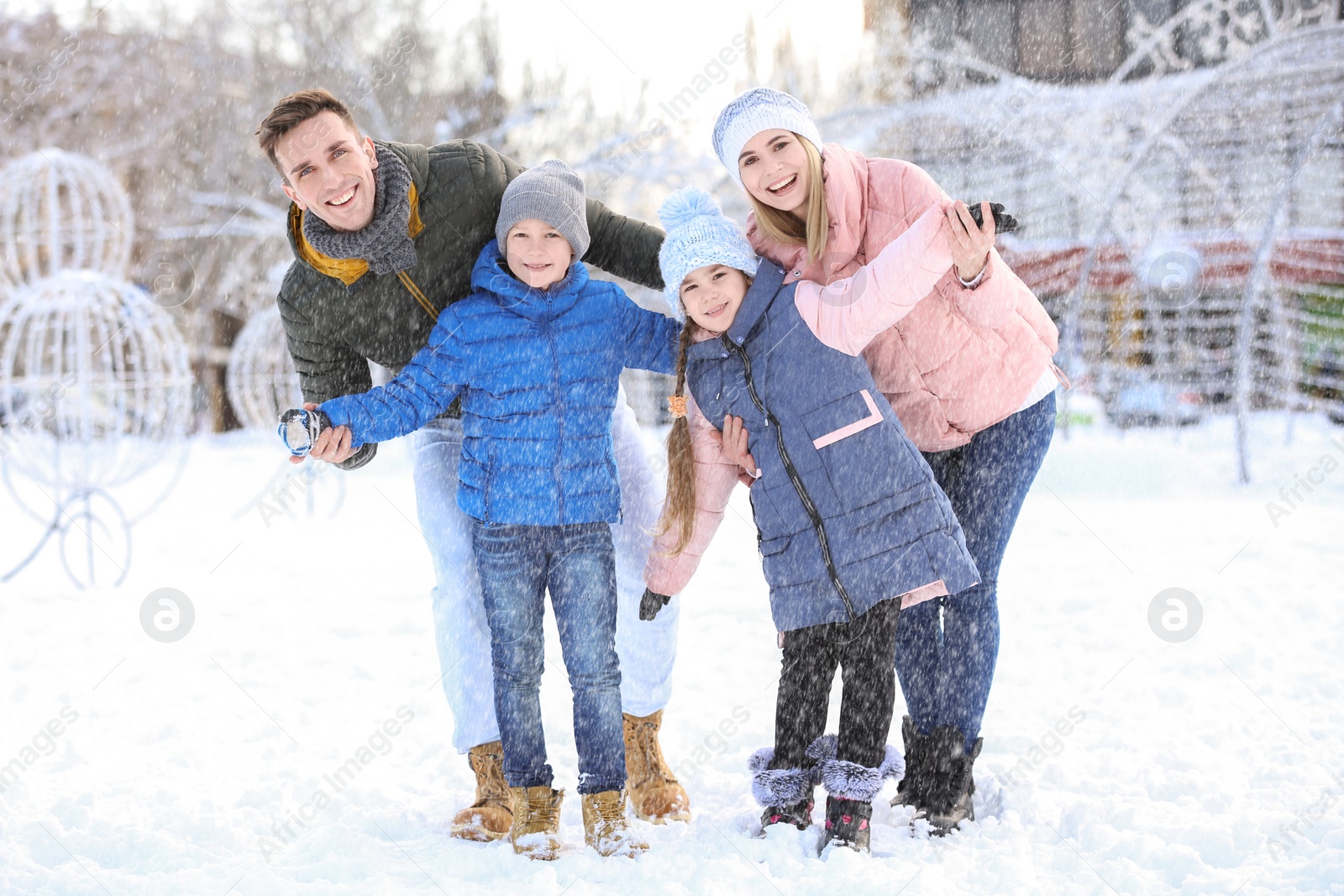 Photo of Portrait of happy family outdoors on winter day