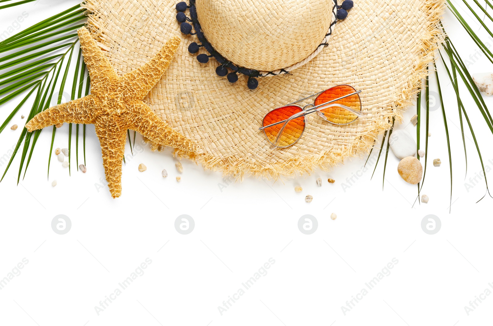 Photo of Flat lay composition with stylish hat and beach objects on white background