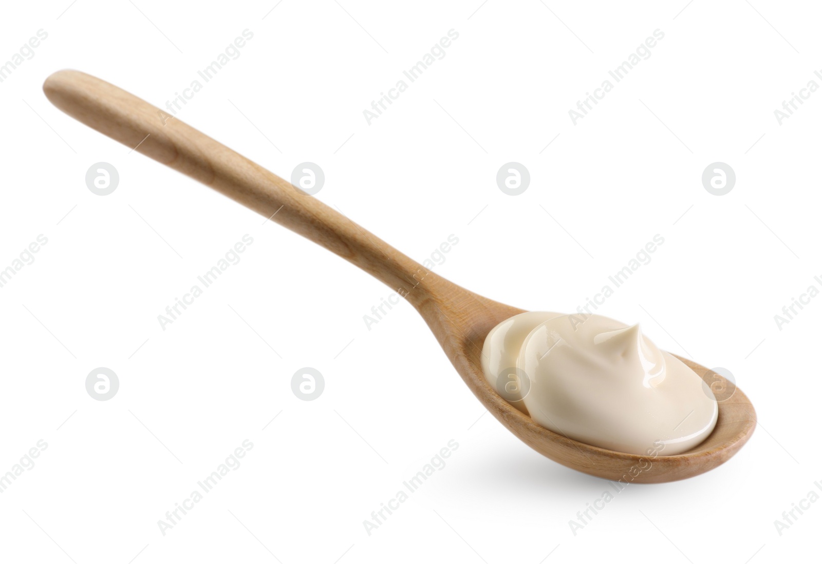 Photo of Natural yogurt in wooden spoon isolated on white