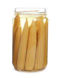 Glass jar with pickled baby corn isolated on white