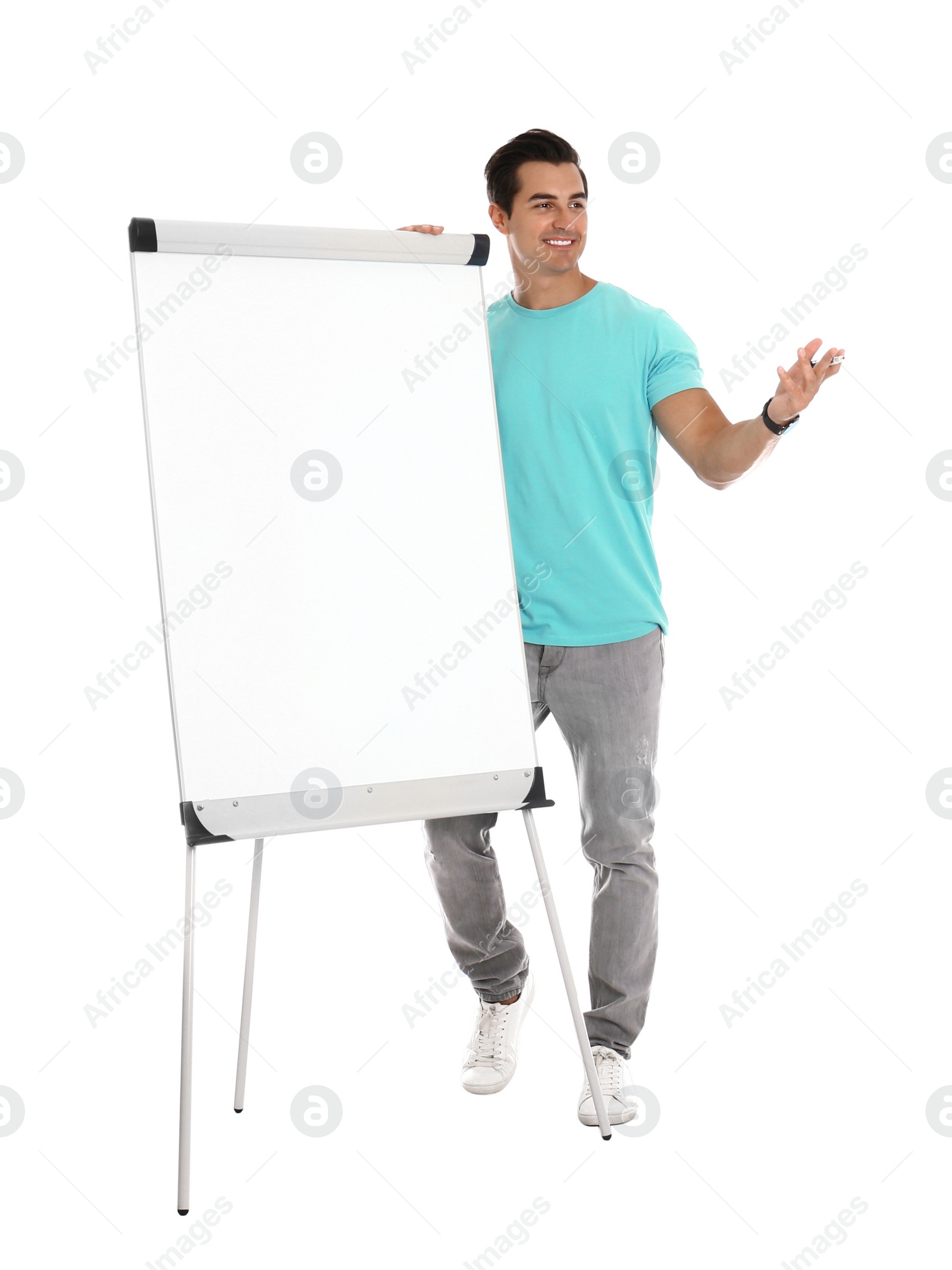 Photo of Professional business trainer near flip chart on white background