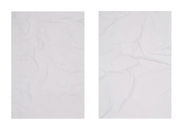 Collection of creased blank posters on white background