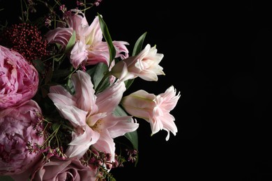 Photo of Beautiful bouquet of different flowers on dark background, closeup