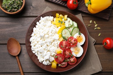 Photo of Delicious cottage cheese with vegetables and boiled egg served for breakfast on wooden table, flat lay