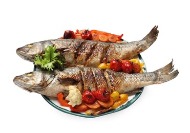 Plate with delicious roasted sea bass fish and vegetables on white background