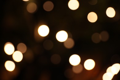 Blurred view of city street with lights at night. Bokeh effect