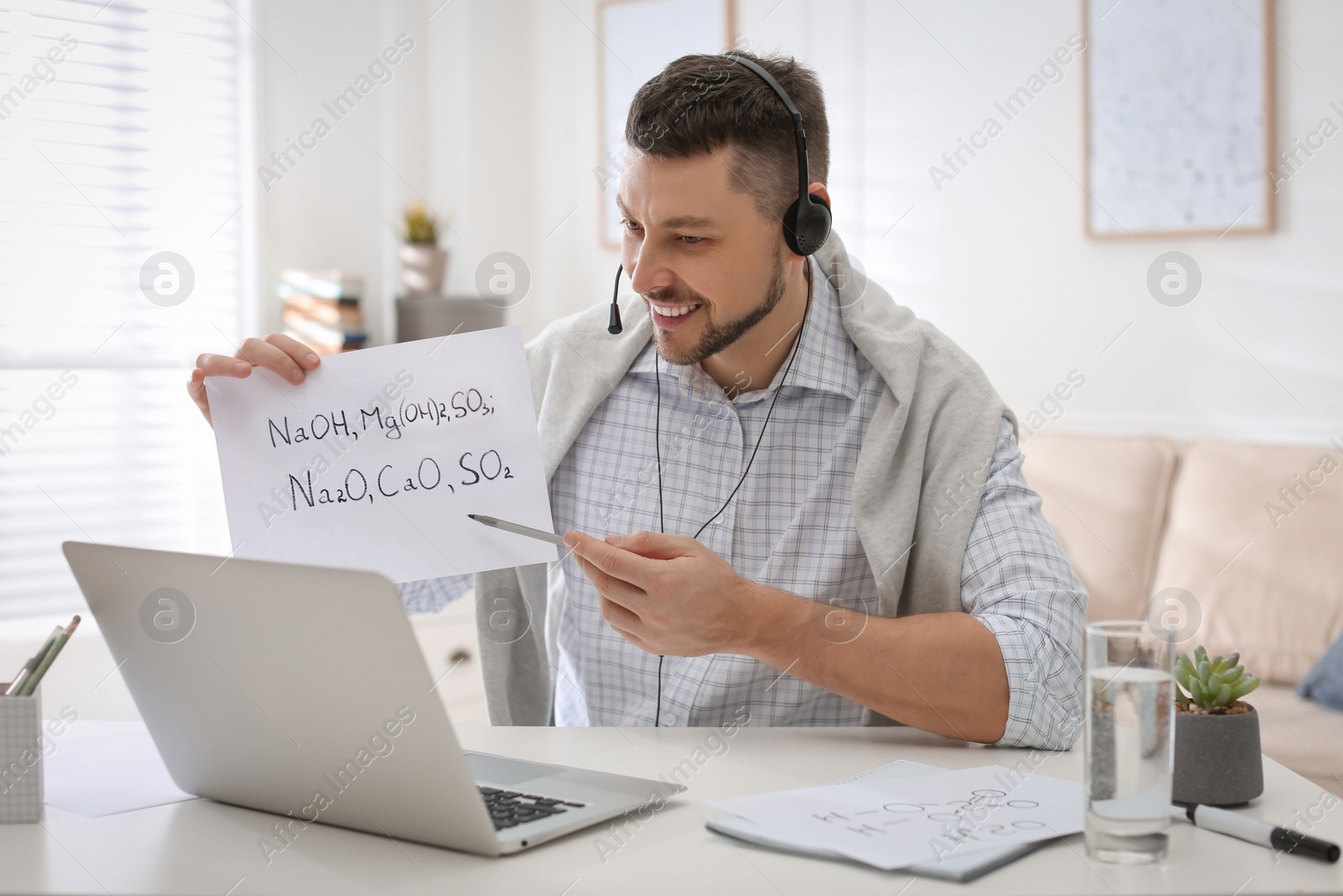 Photo of Teacher conducting online lesson at home during COVID-19 quarantine