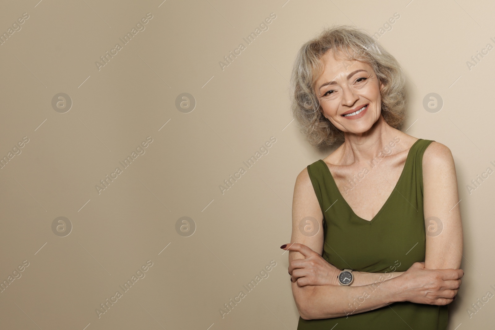 Photo of Portrait of mature woman on color background. Space for text