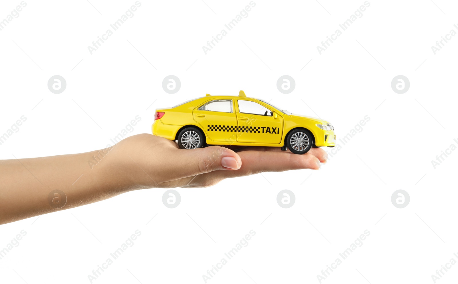 Photo of Woman with taxi car model on white background, closeup