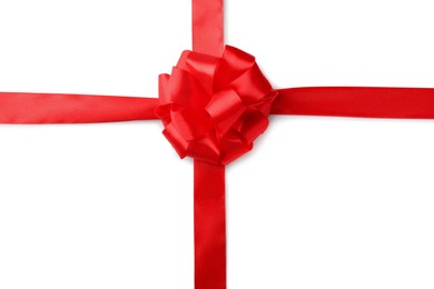 Red bow and ribbon on white background, top view