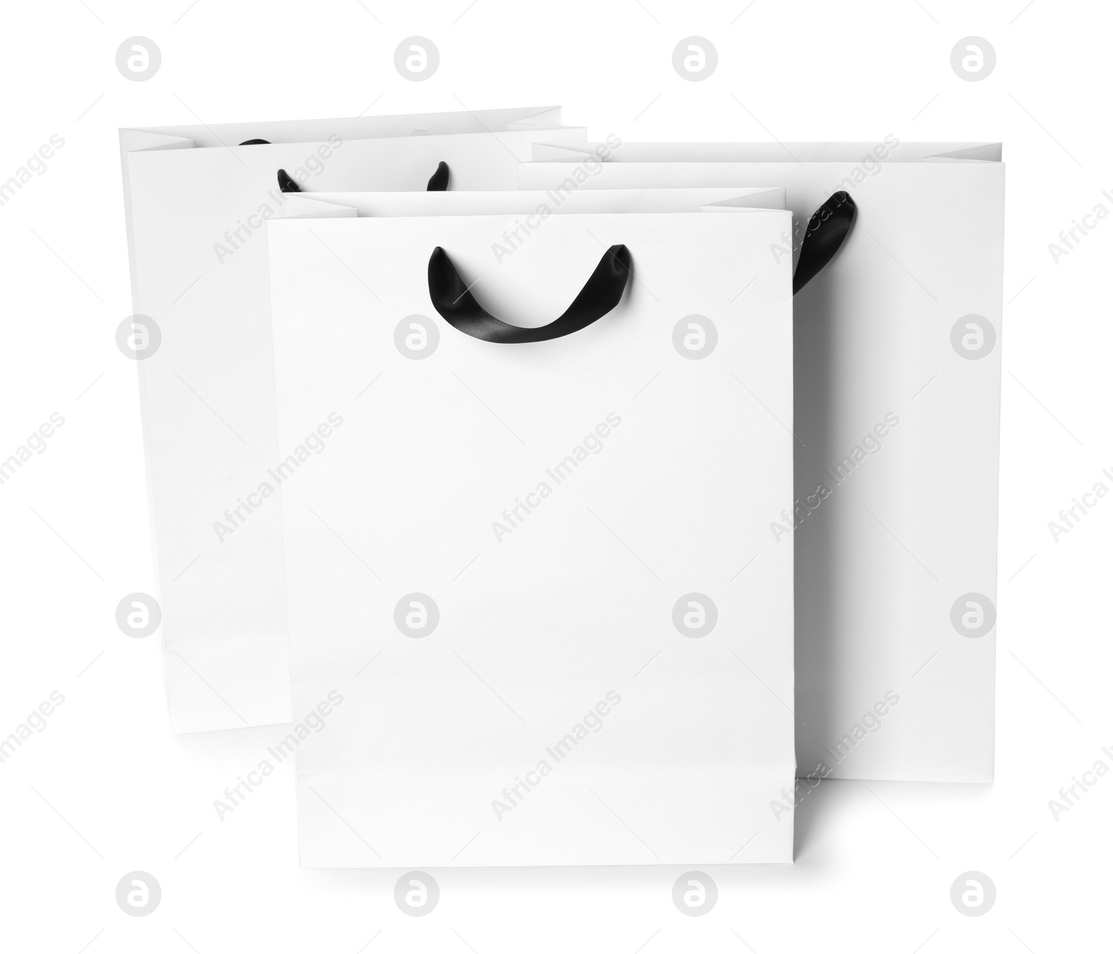 Photo of Paper shopping bags isolated on white. Mock up for design