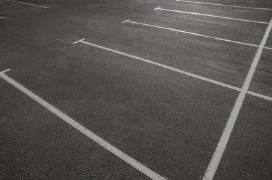 Outdoor car parking lot with white marking lines 