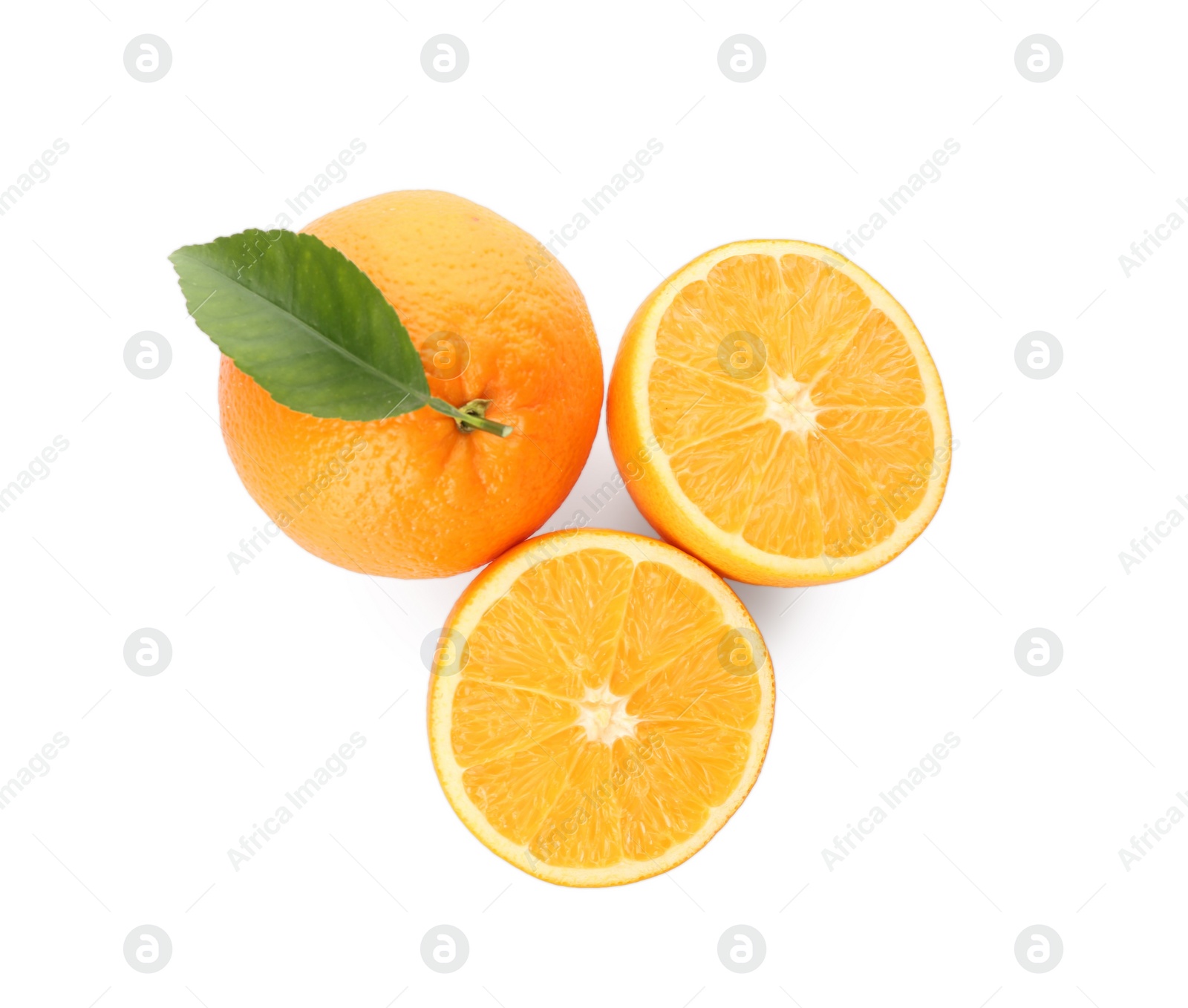 Photo of Cut and whole fresh ripe oranges with green leaf on white background, top view