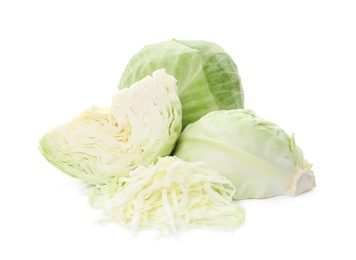 Whole and cut fresh ripe cabbages on white background