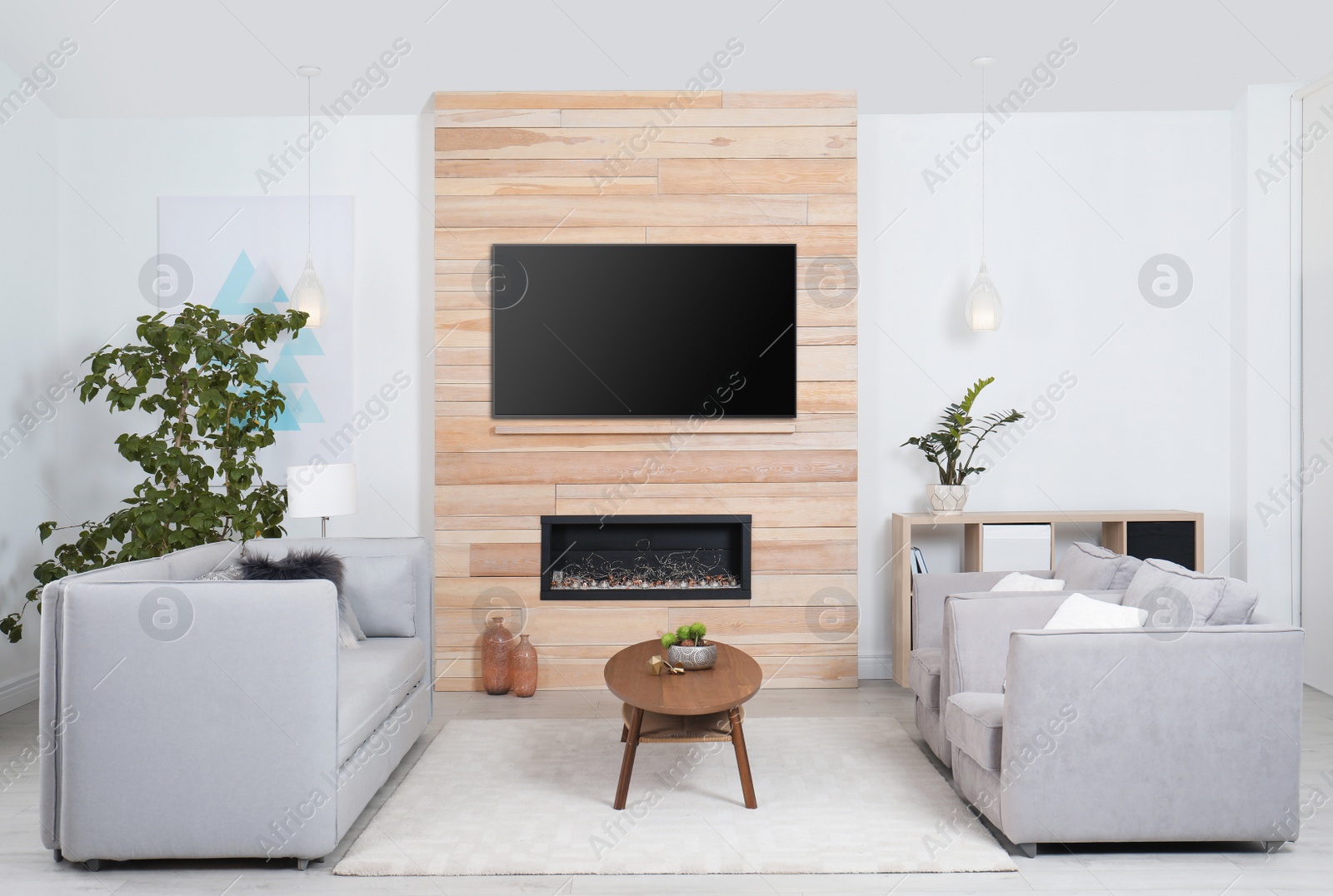 Photo of Living room interior with decorative fireplace in wooden wall