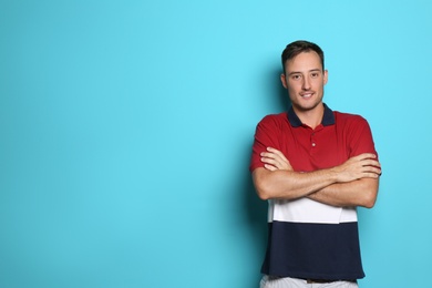 Young man in casual clothes posing on color background. Space for text