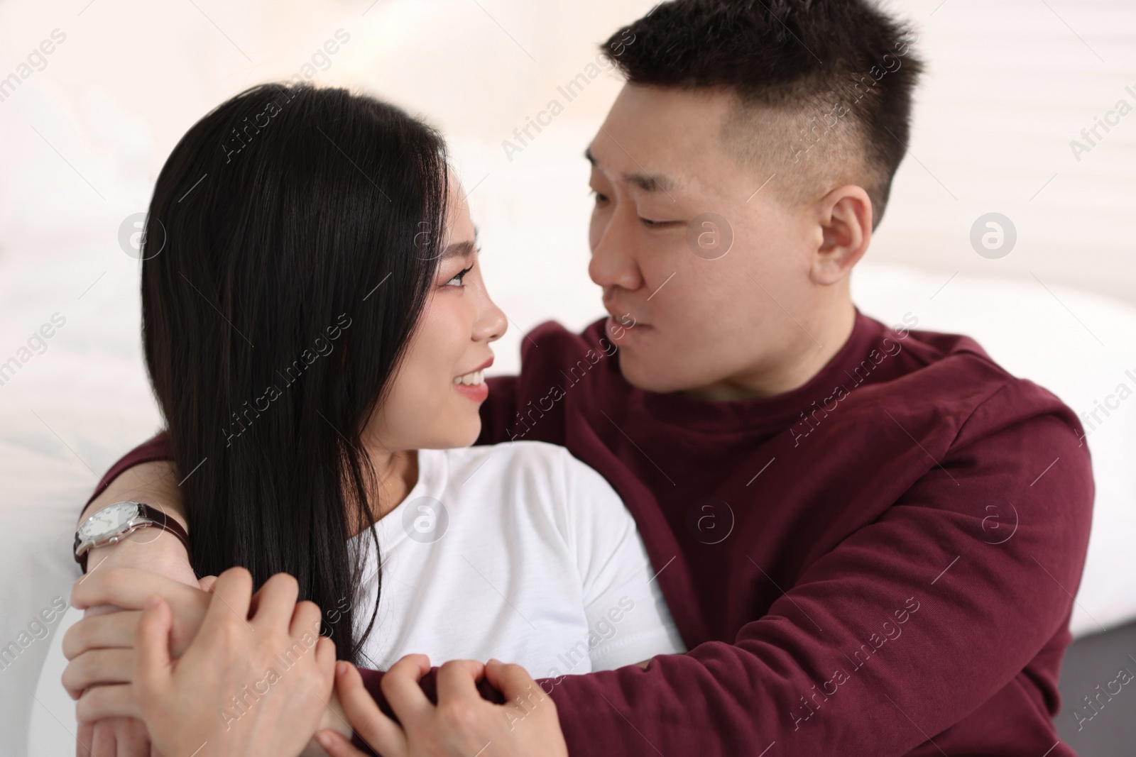 Photo of Portrait of lovely young couple at home