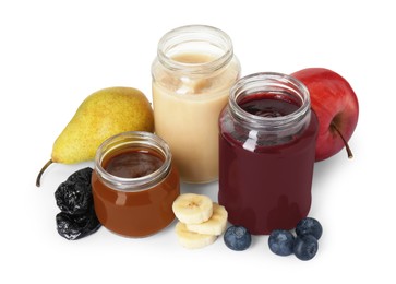 Jars with healthy baby food, blueberries, prunes and fresh fruits isolated on white