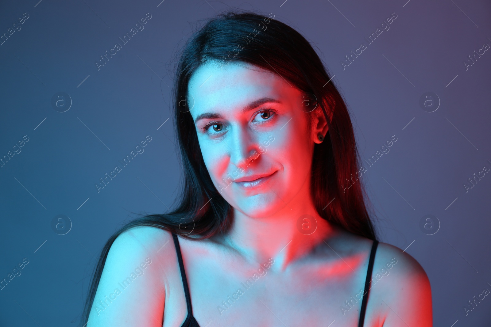 Photo of Portrait of beautiful young woman on color background