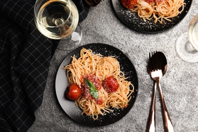 Photo of Flat lay composition with tasty pasta on grey table