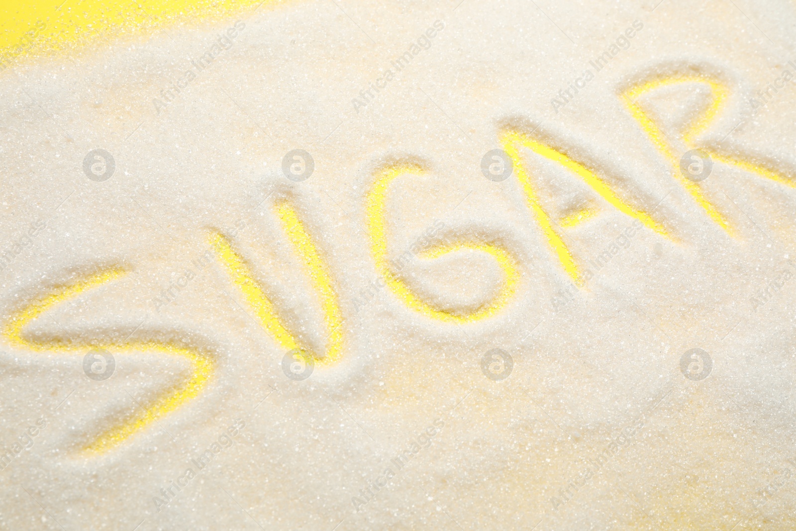 Photo of Composition with word SUGAR on yellow background